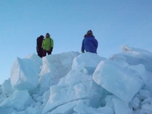 Ross, Rachel and Mike climb a pile of pack ice 